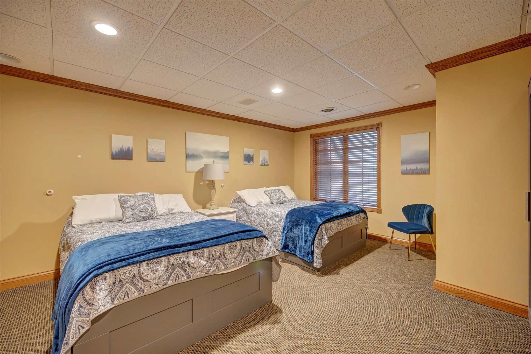 Shared bedroom with two beds and neutral decor