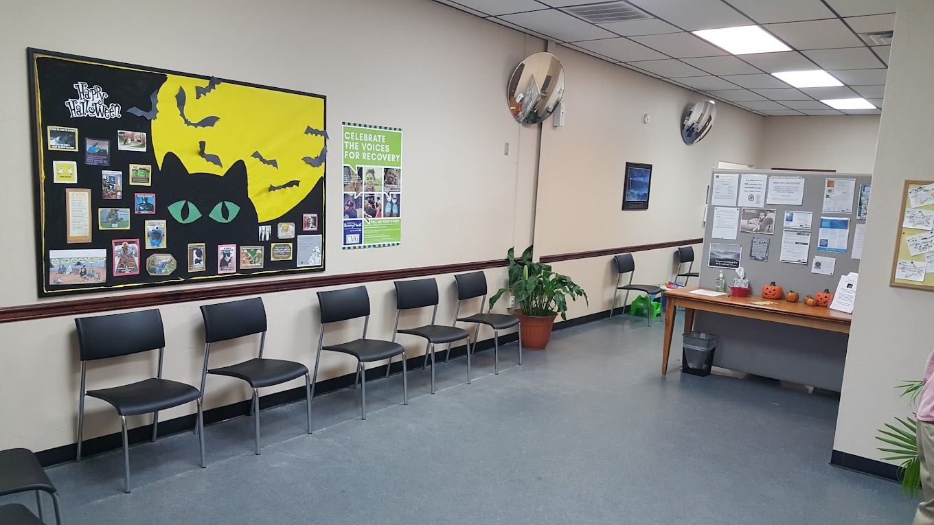 Waiting room with bulletin boards, chairs, and fall decor