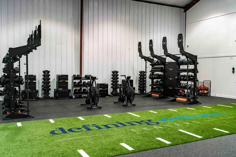 Gym with weight racks and turf flooring