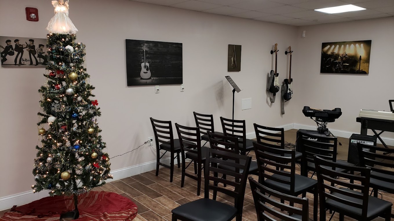 Music room with instruments and seating.