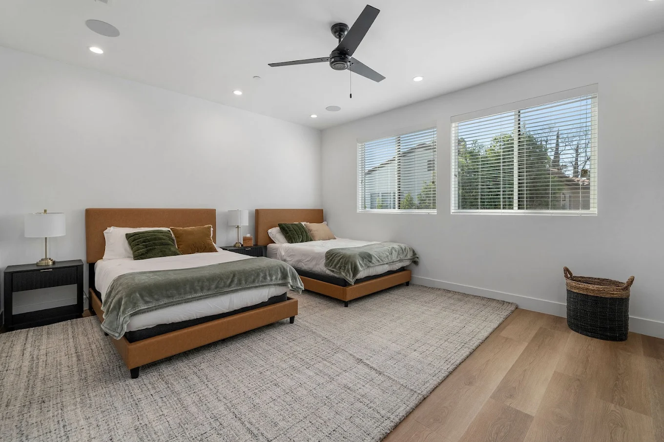 Shared room with two beds and large windows