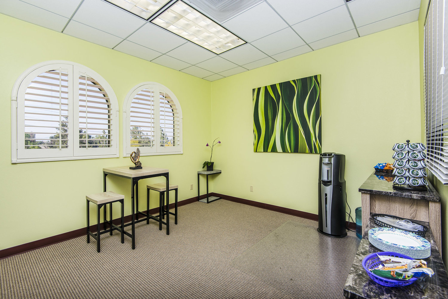 Small table, coffee machine, and windowed snack space