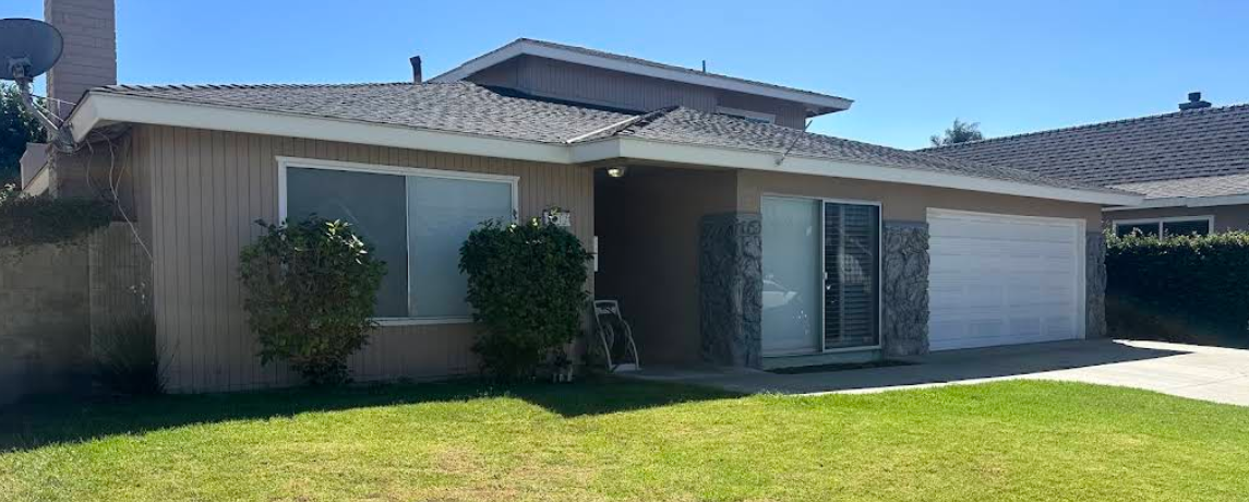 Single-story rehab center with garage and front lawn