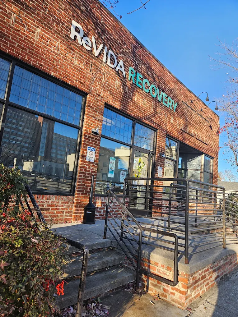ReVIDA Recovery clinic entrance with ramp and brick exterior