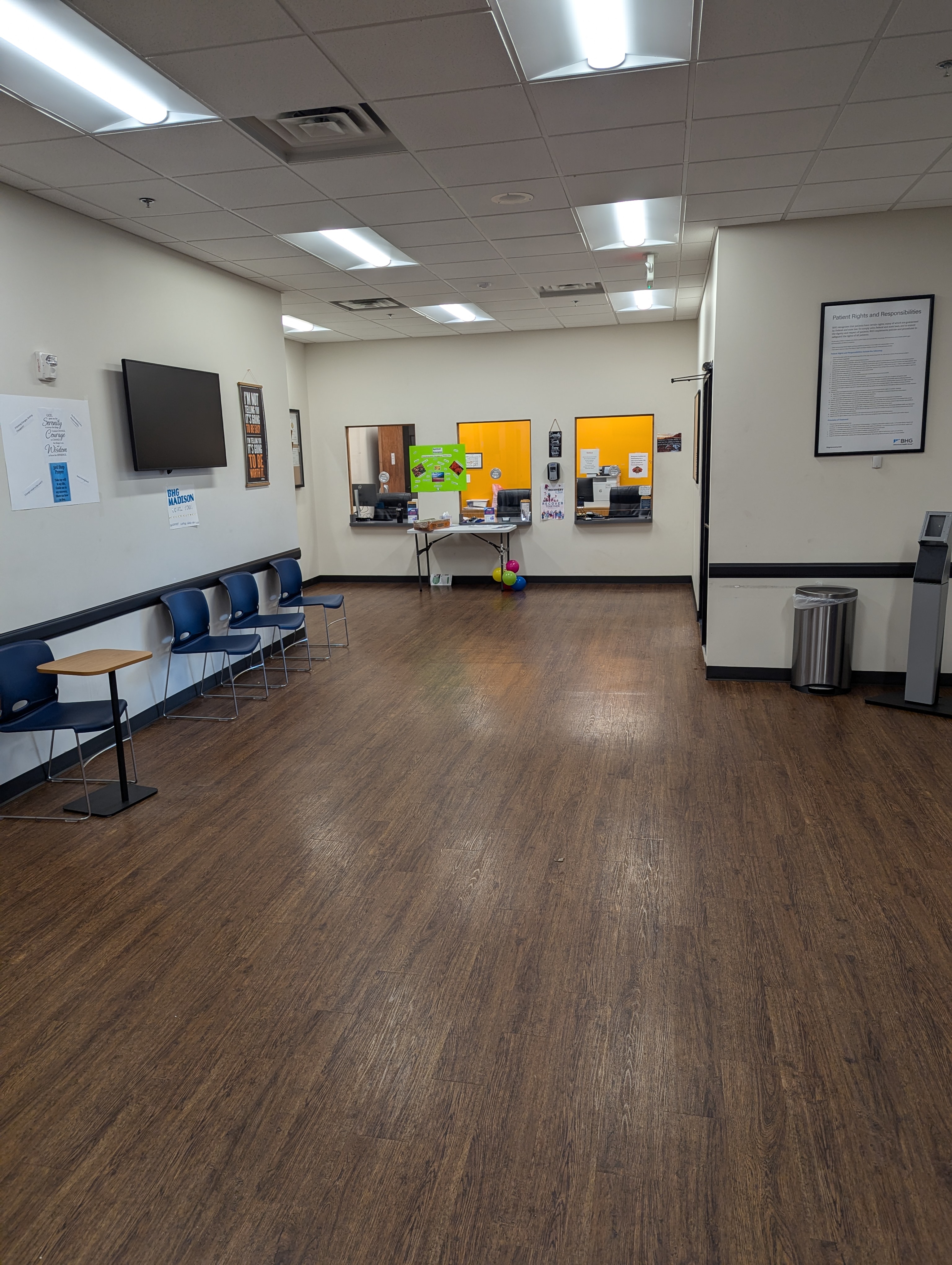 Spacious lobby with reception windows and seating area