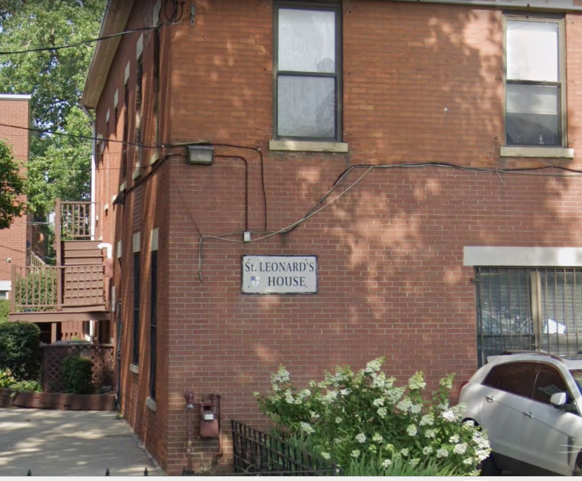 Side angle of St. Leonard’s House showing windows and trees.