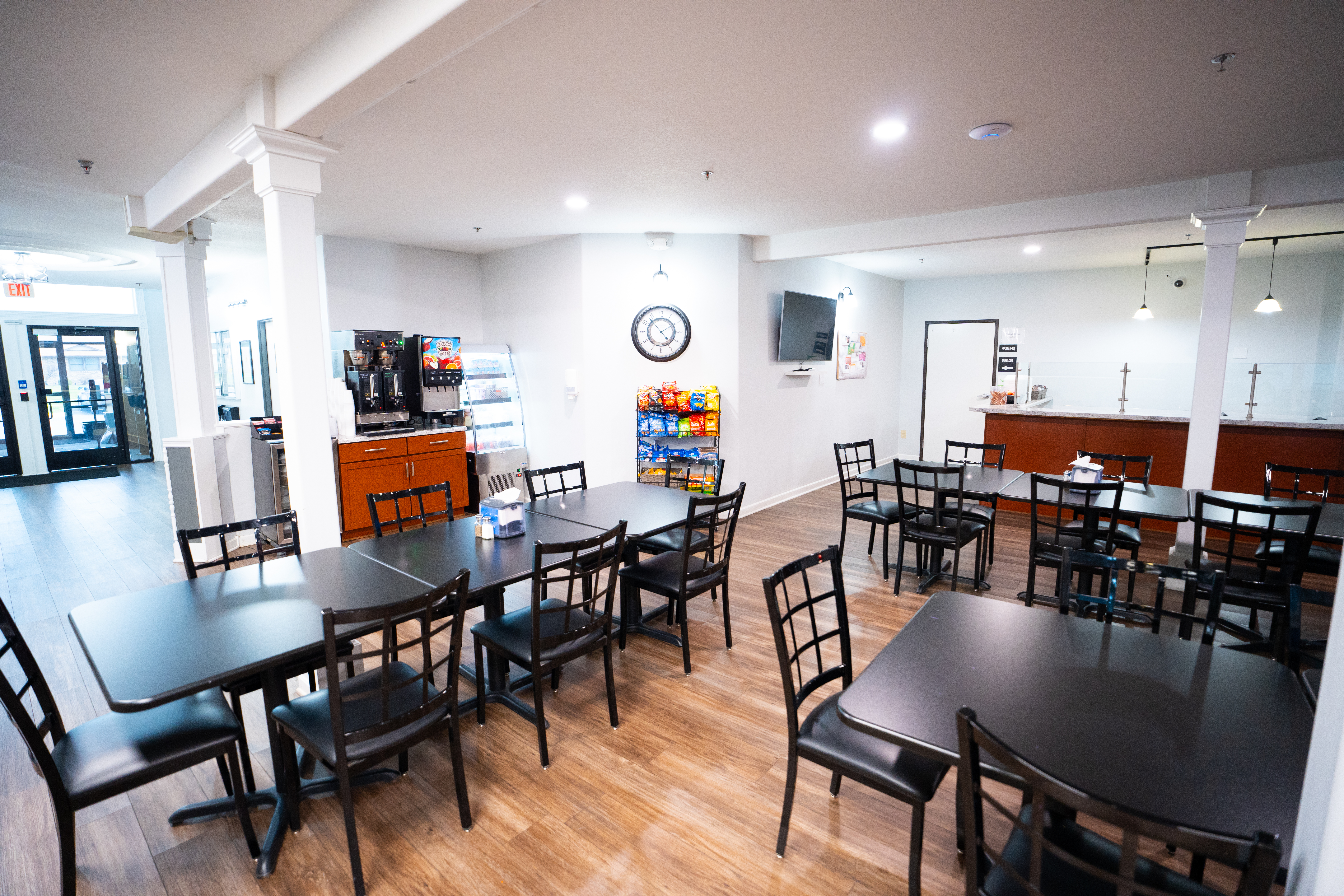 Dining area with snack bar, coffee station, and TV
