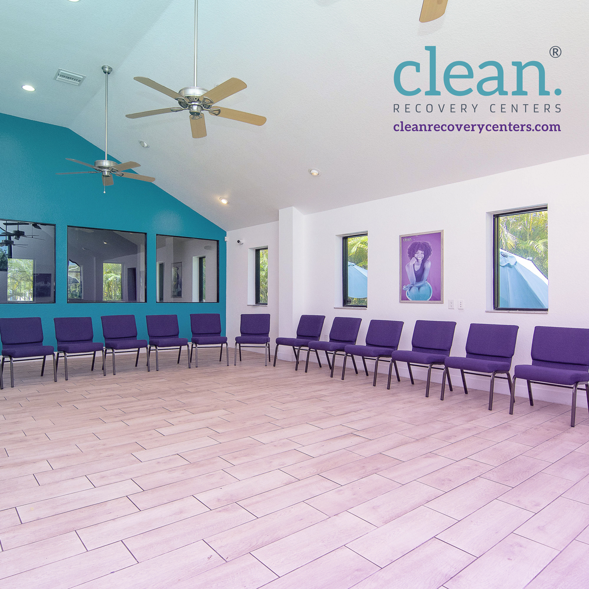 Spacious therapy room with purple chairs in a large circle