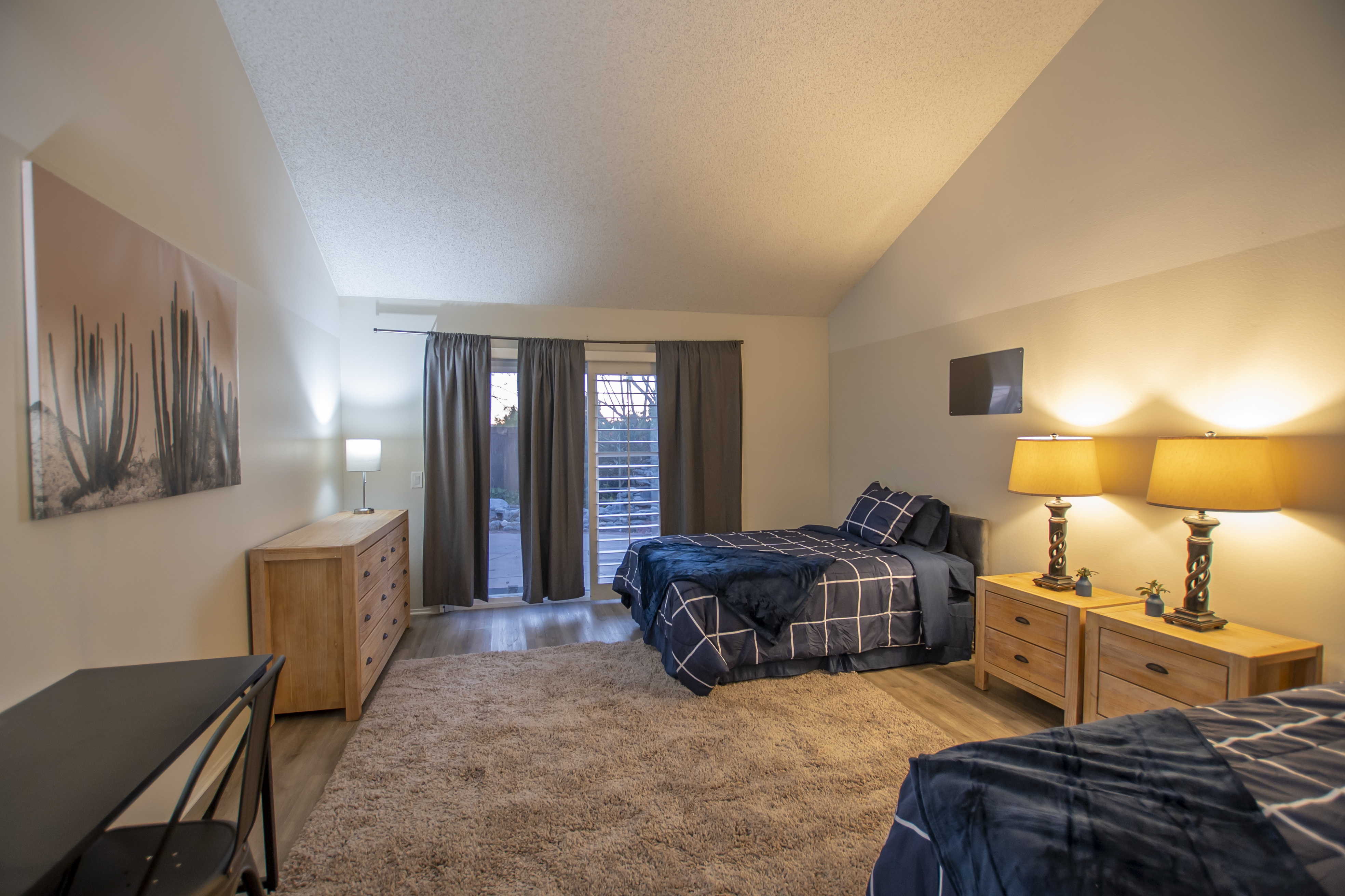 Cozy bedroom with twin beds and modern art