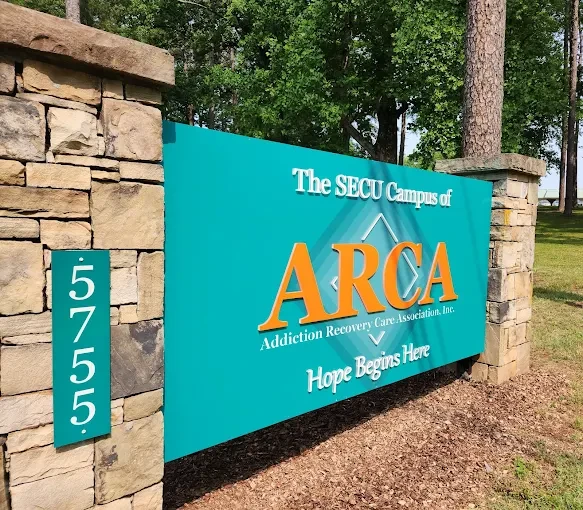 Welcome sign for ARCA SECU Campus with slogan and address