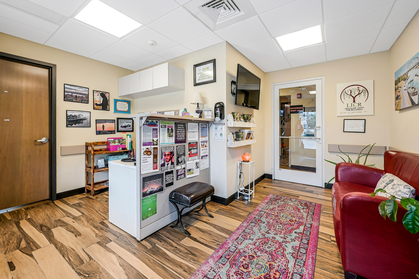 Reception space with seating, bulletin board, and décor