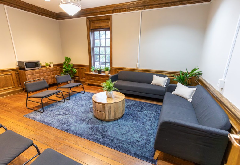 Group room with sofas and chairs around coffee table