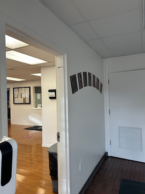 Interior hallway leading to the lobby and reception area