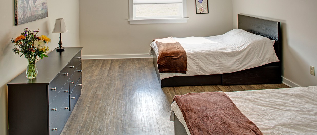 Shared bedroom with two beds and dresser at The Ranch Pennsylvania treatment center