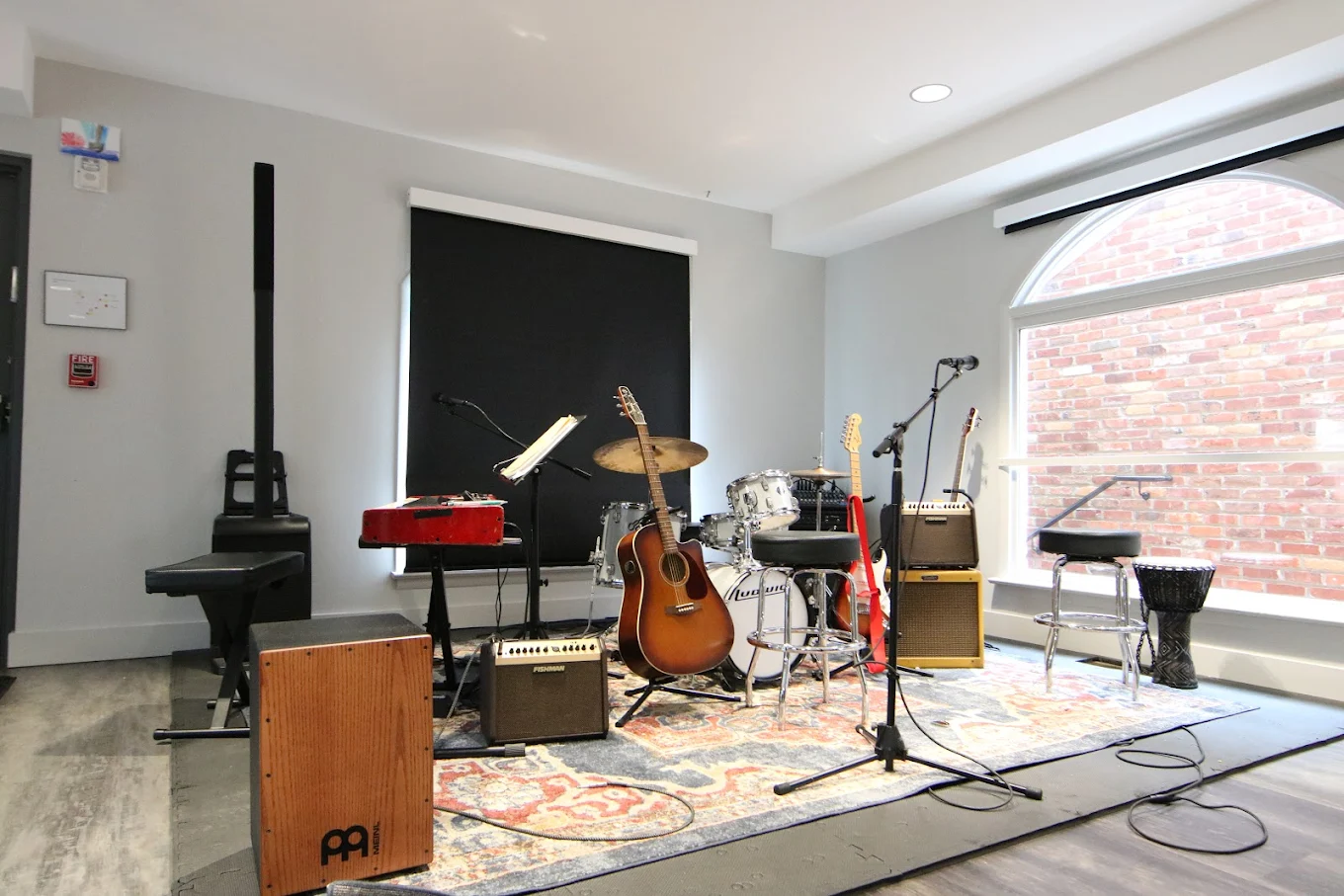 Room with guitars, drums, and mics for music therapy