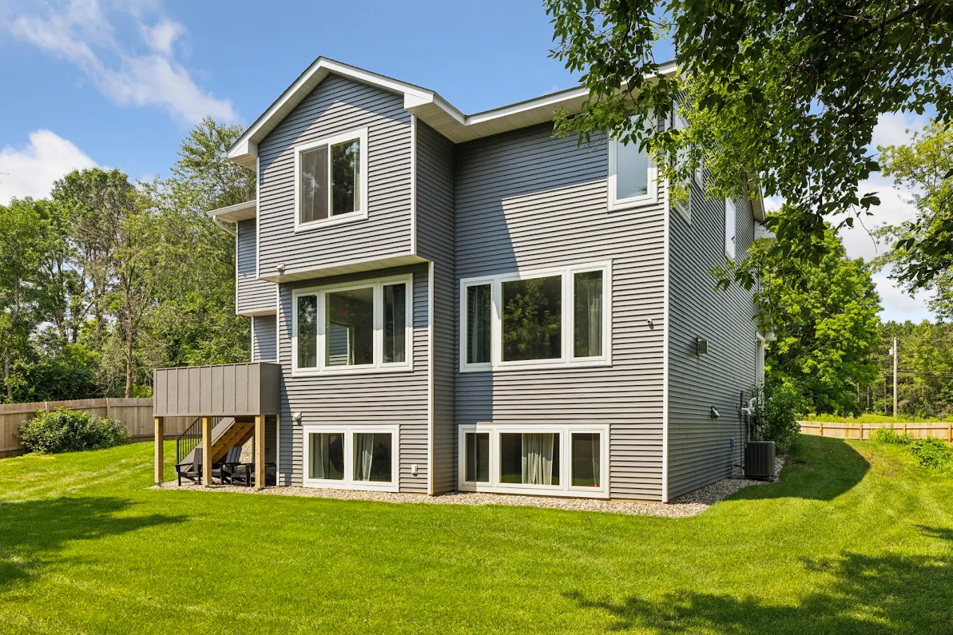 Lawn and garden outside modern gray house