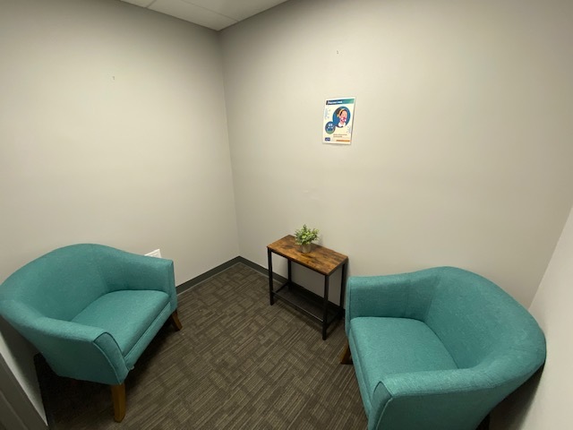 Lounge area with sofas, and a side table.