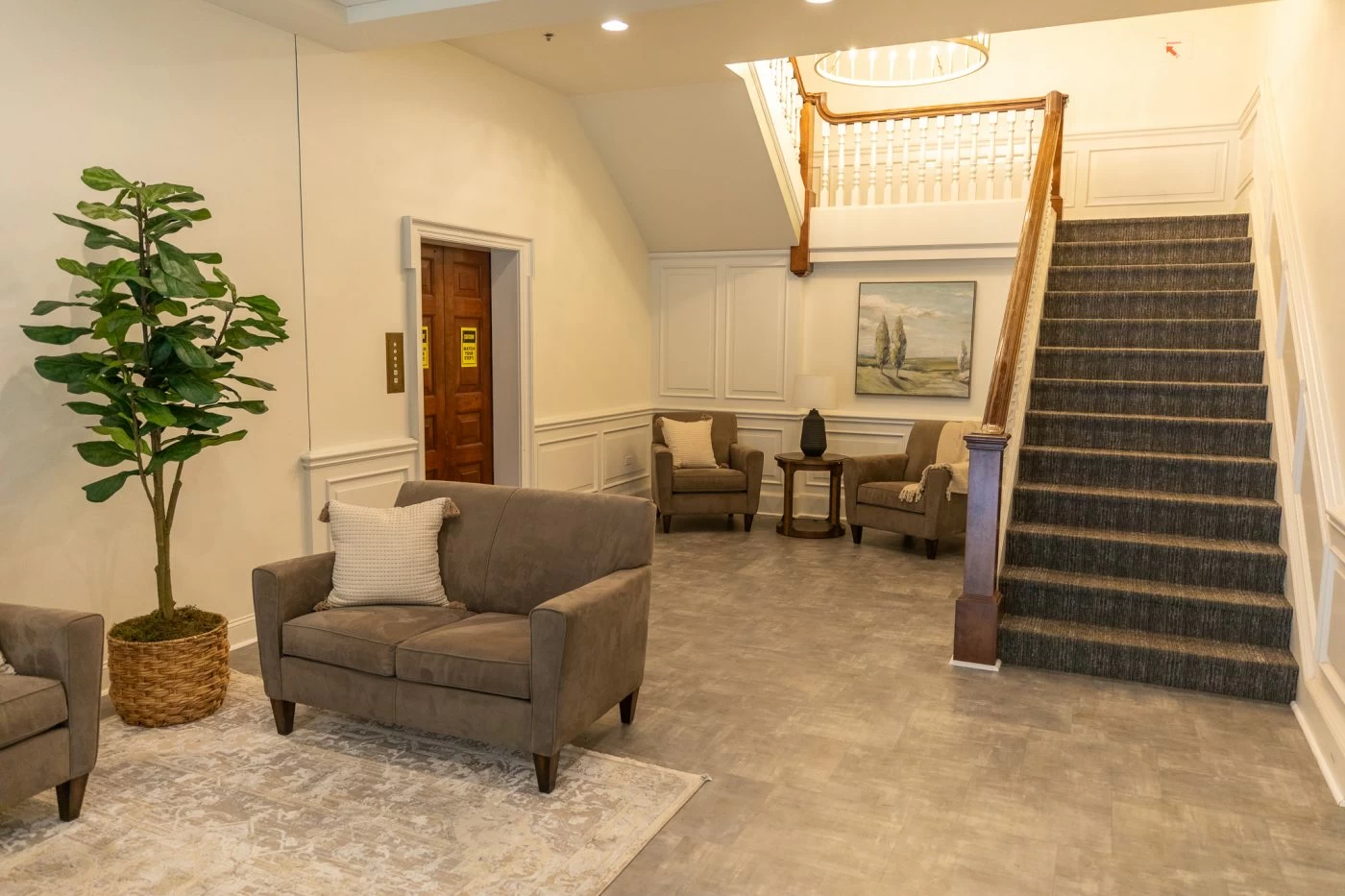 Welcoming lobby with seating and staircase