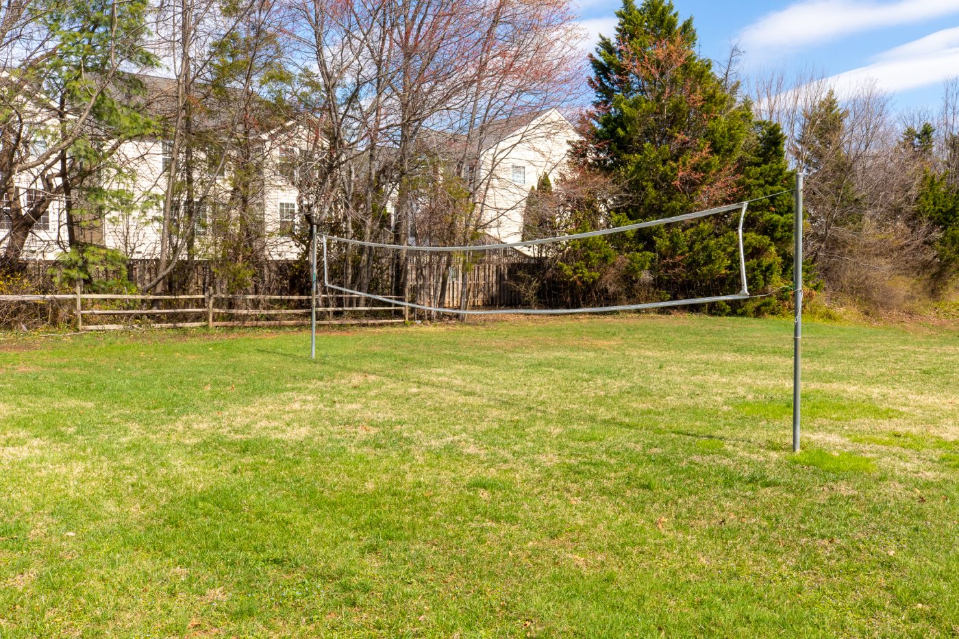 Outdoor volleyball court on grassy lawn