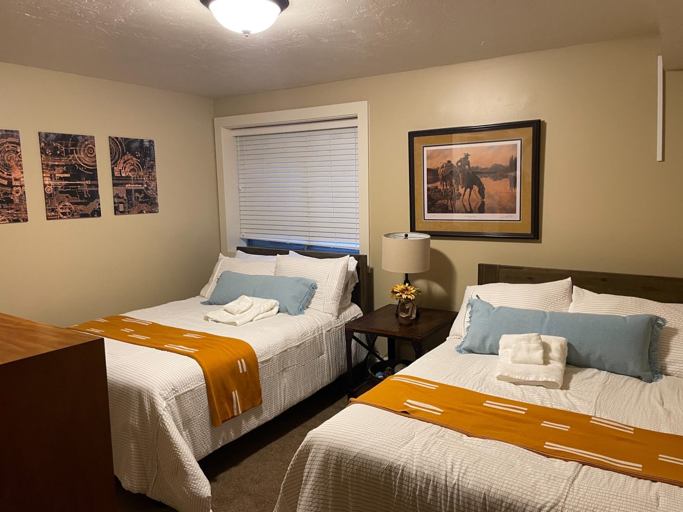 Bedroom with two beds and bedside table