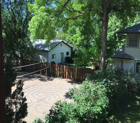 Garden path labyrinth surrounded by trees