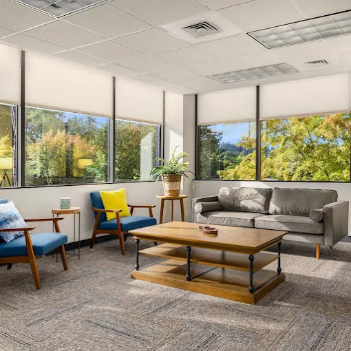 Bright lounge with large windows and comfortable seating