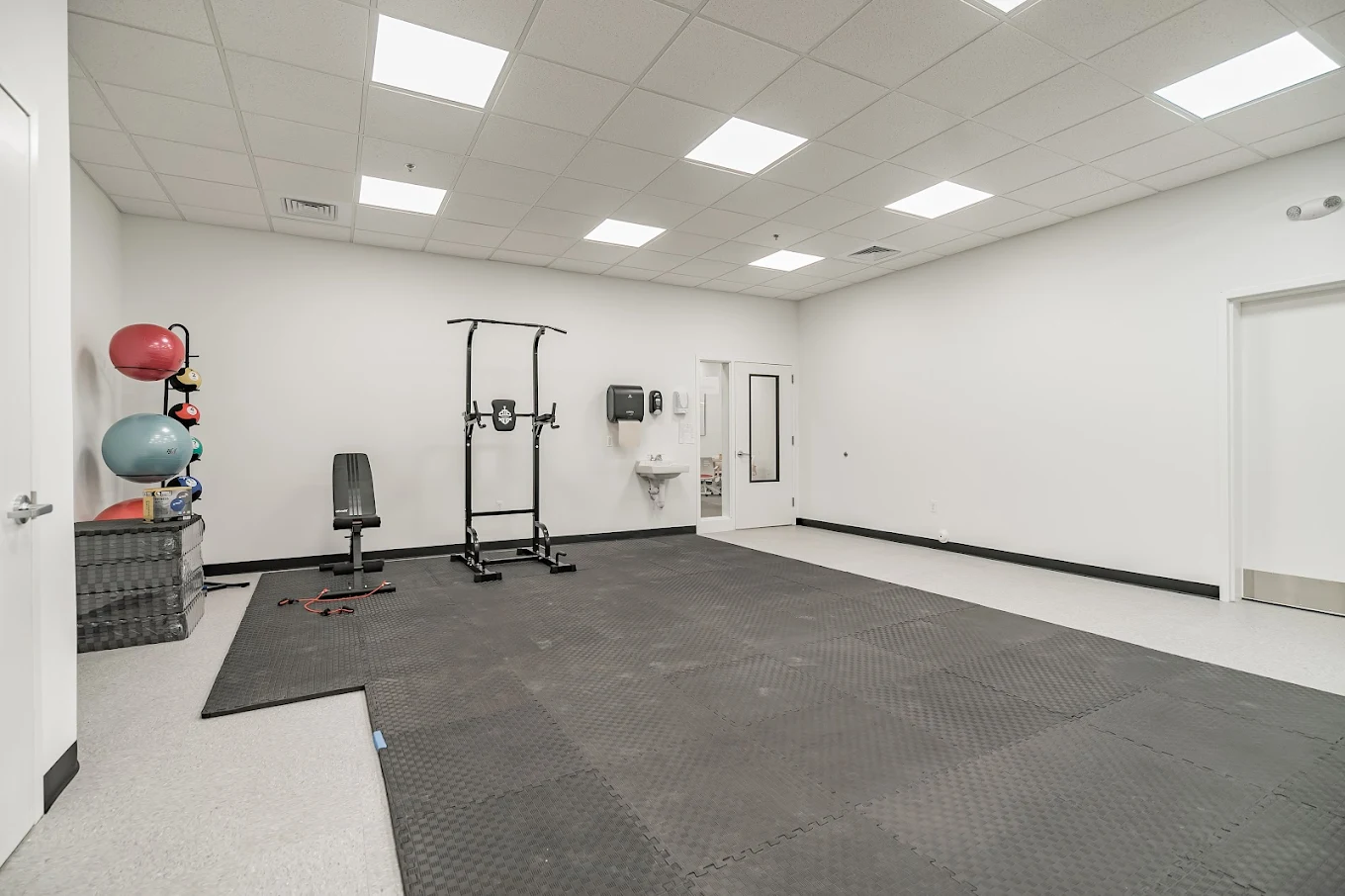 Fitness room with exercise equipment and open workout space