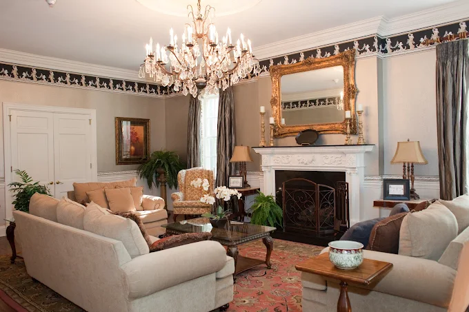 Stylish lounge with chandelier and ornate fireplace