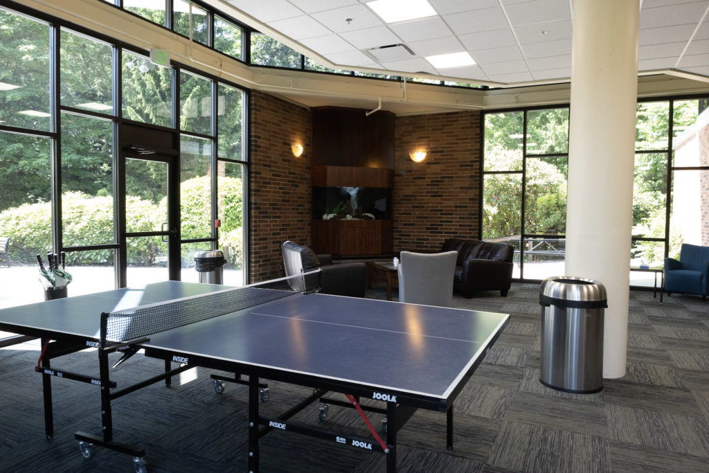 Recreation lounge with ping pong table and lounge seating