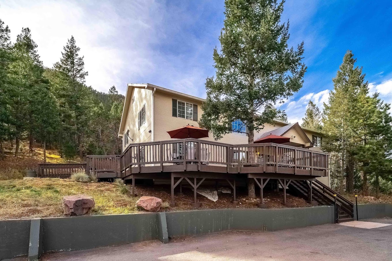 Facility front wooden deck and stairwell entrance.