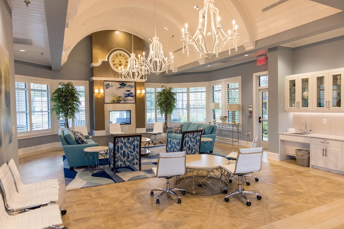 Lounge with sofas, tables, and chandelier lighting