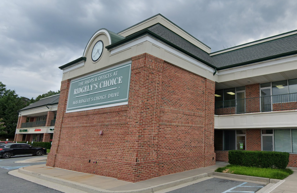 Facility exterior with signage and accessible parking.