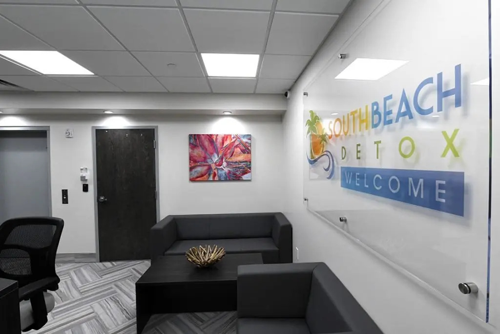 Modern lounge with sofas and South Beach Detox welcome sign