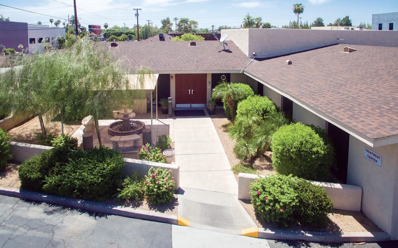 Walkway leading to main entrance with desert landscaping