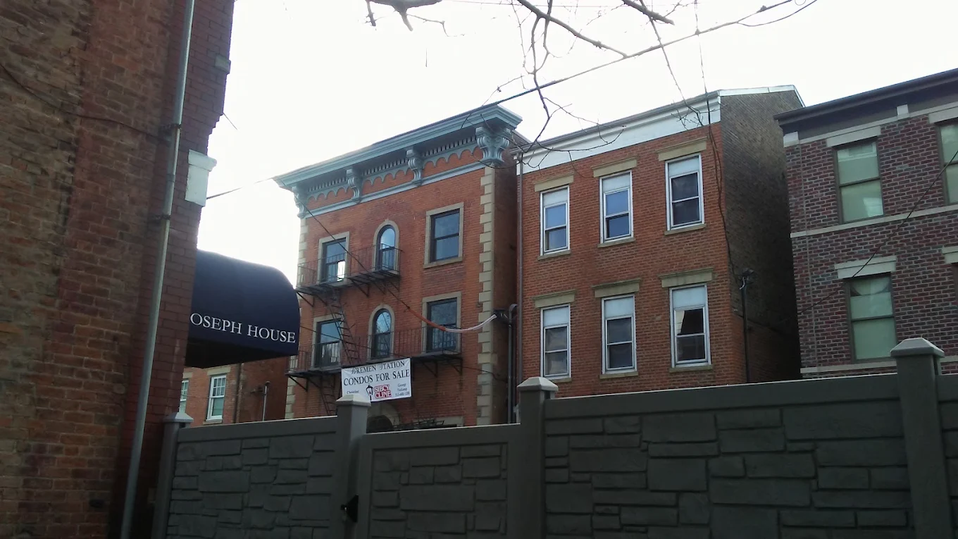 Historic red-brick building with Joseph House awning