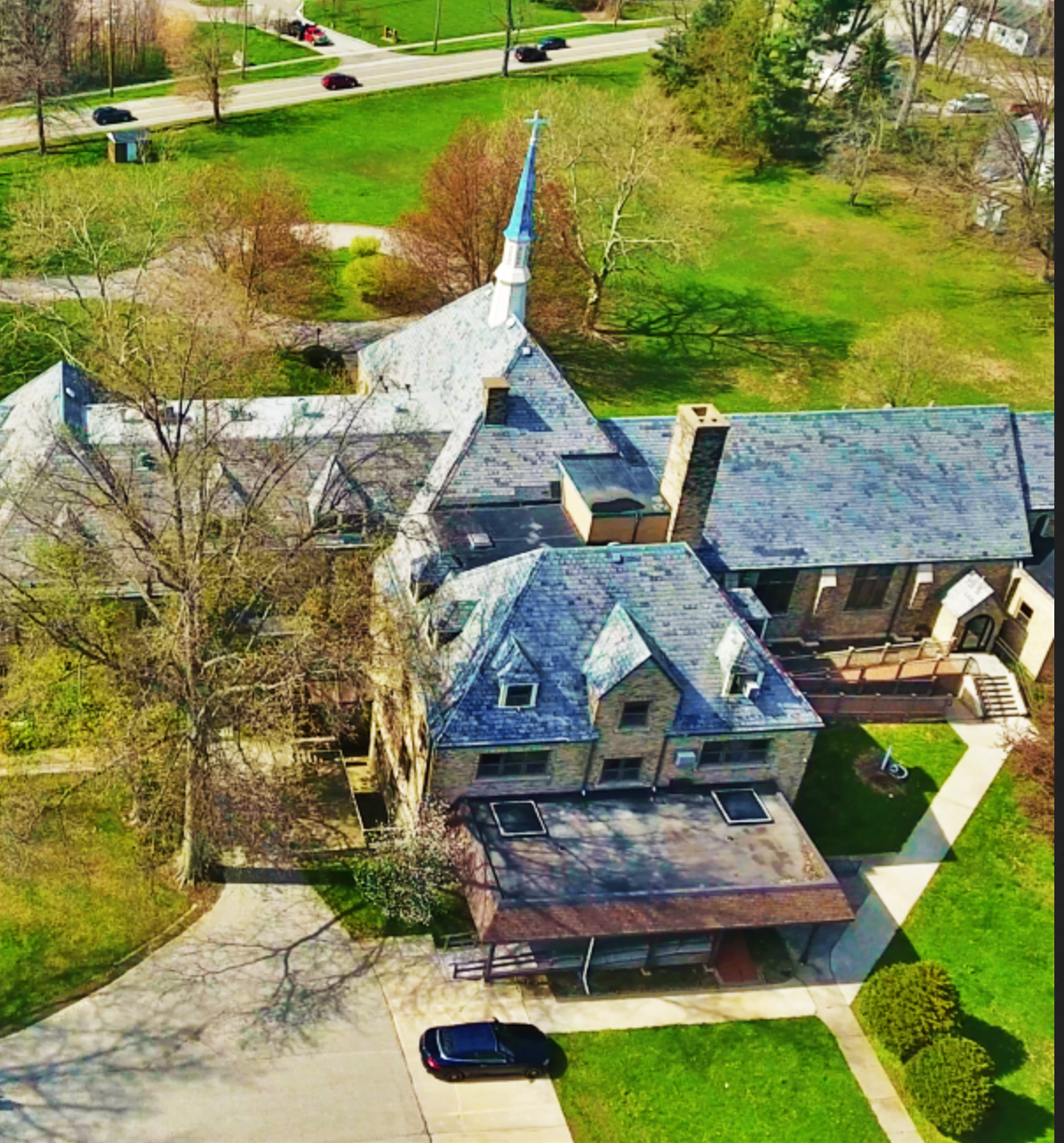 Overhead view of rehab facility with peaked roof and spire