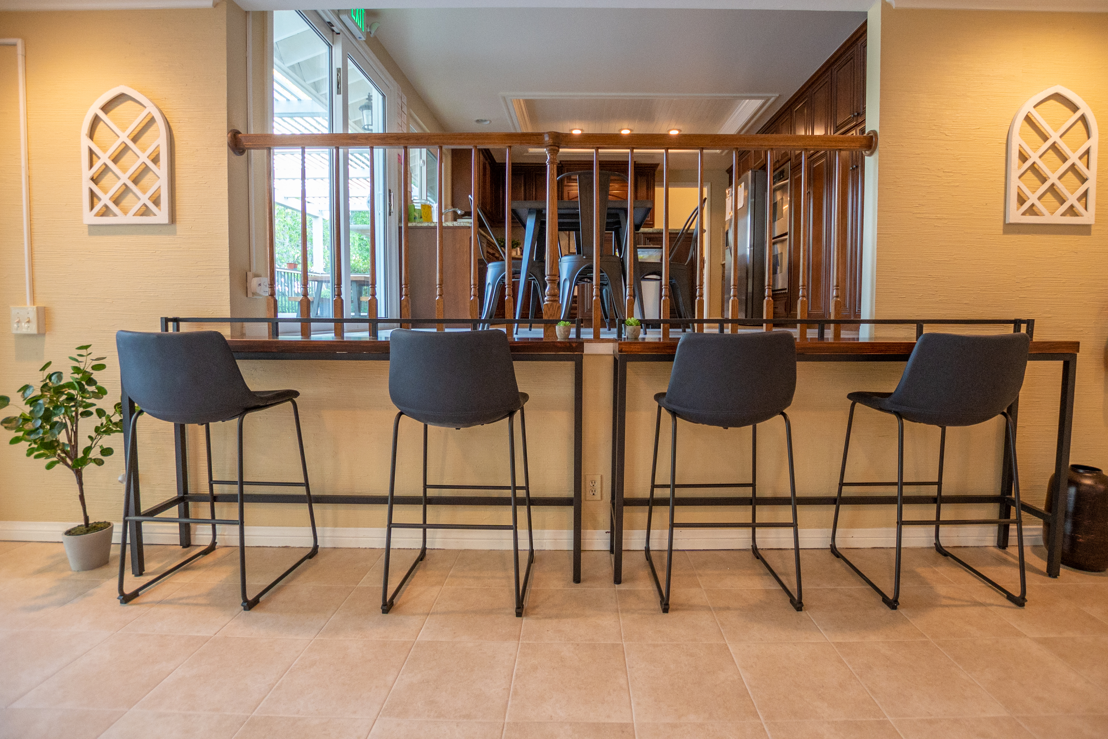 Indoor breakfast bar seating facing kitchen