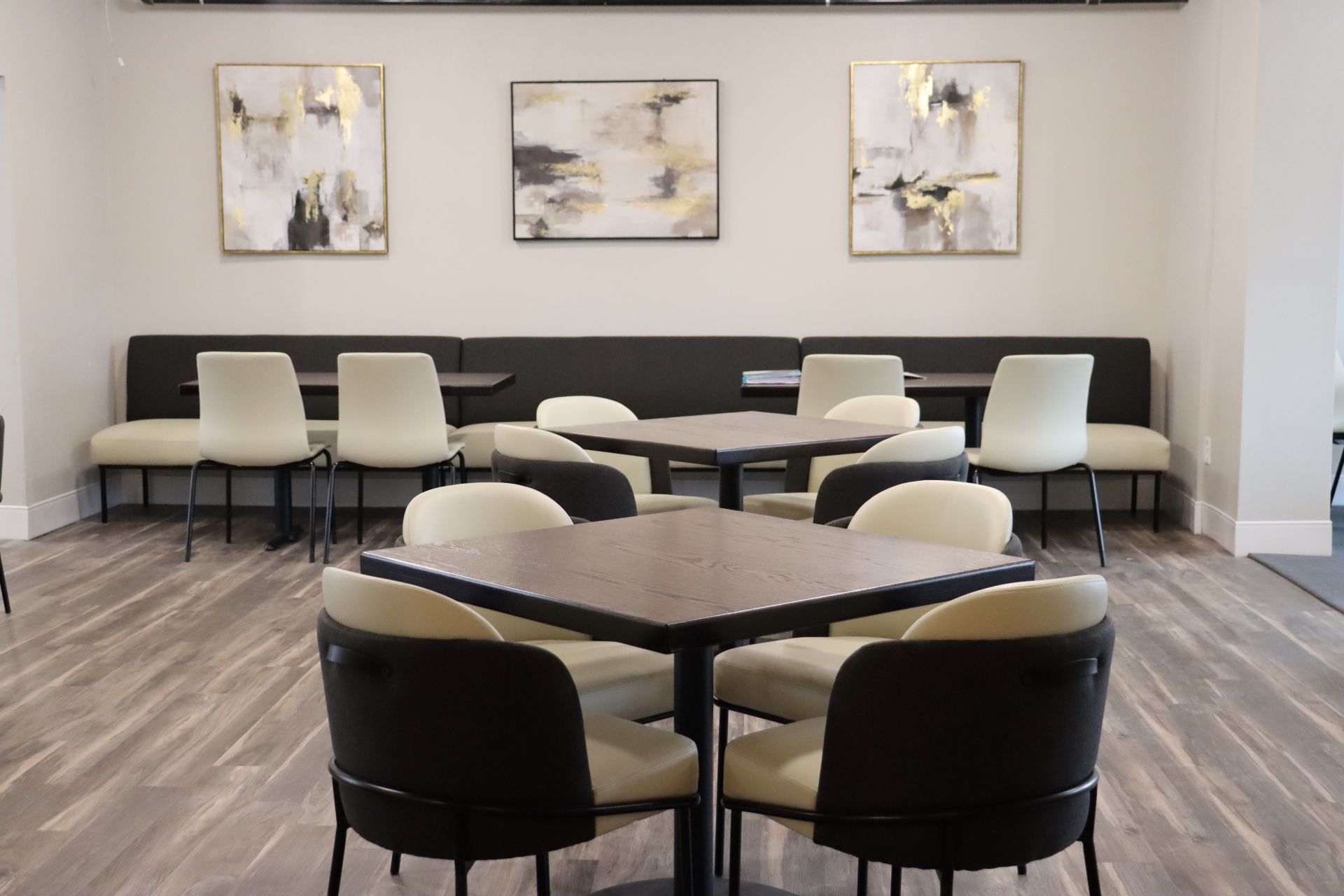 Dining area with tables and white chairs