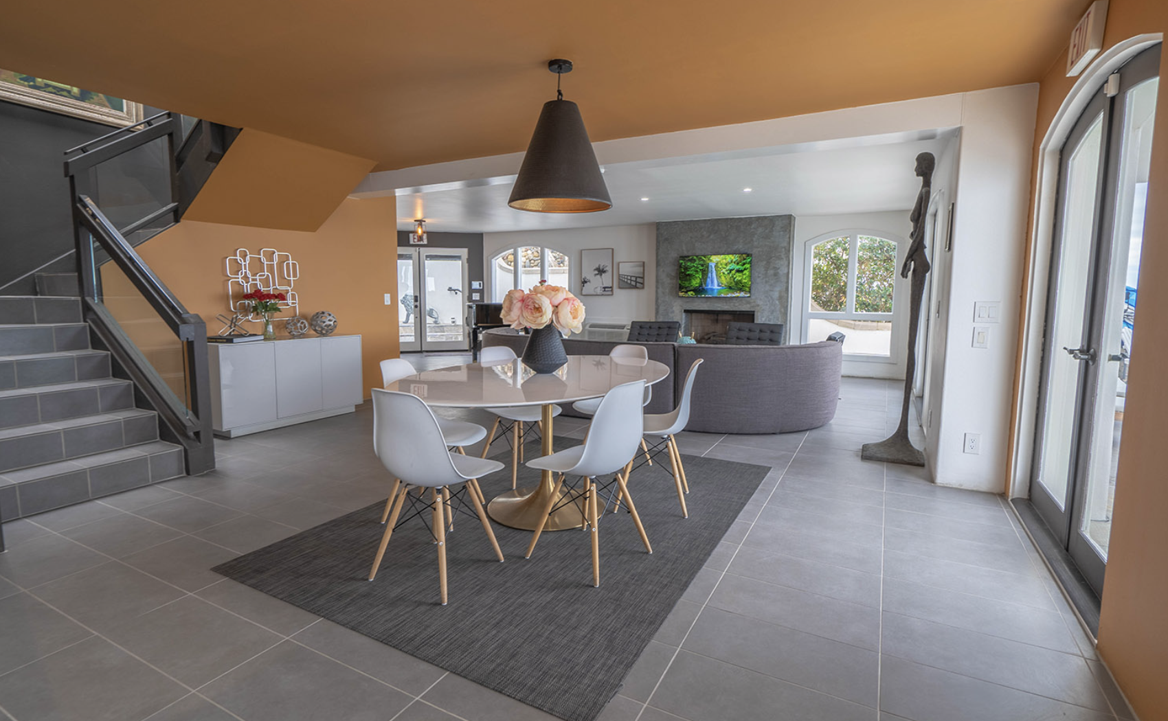 Modern staircase beside dining area with ocean view