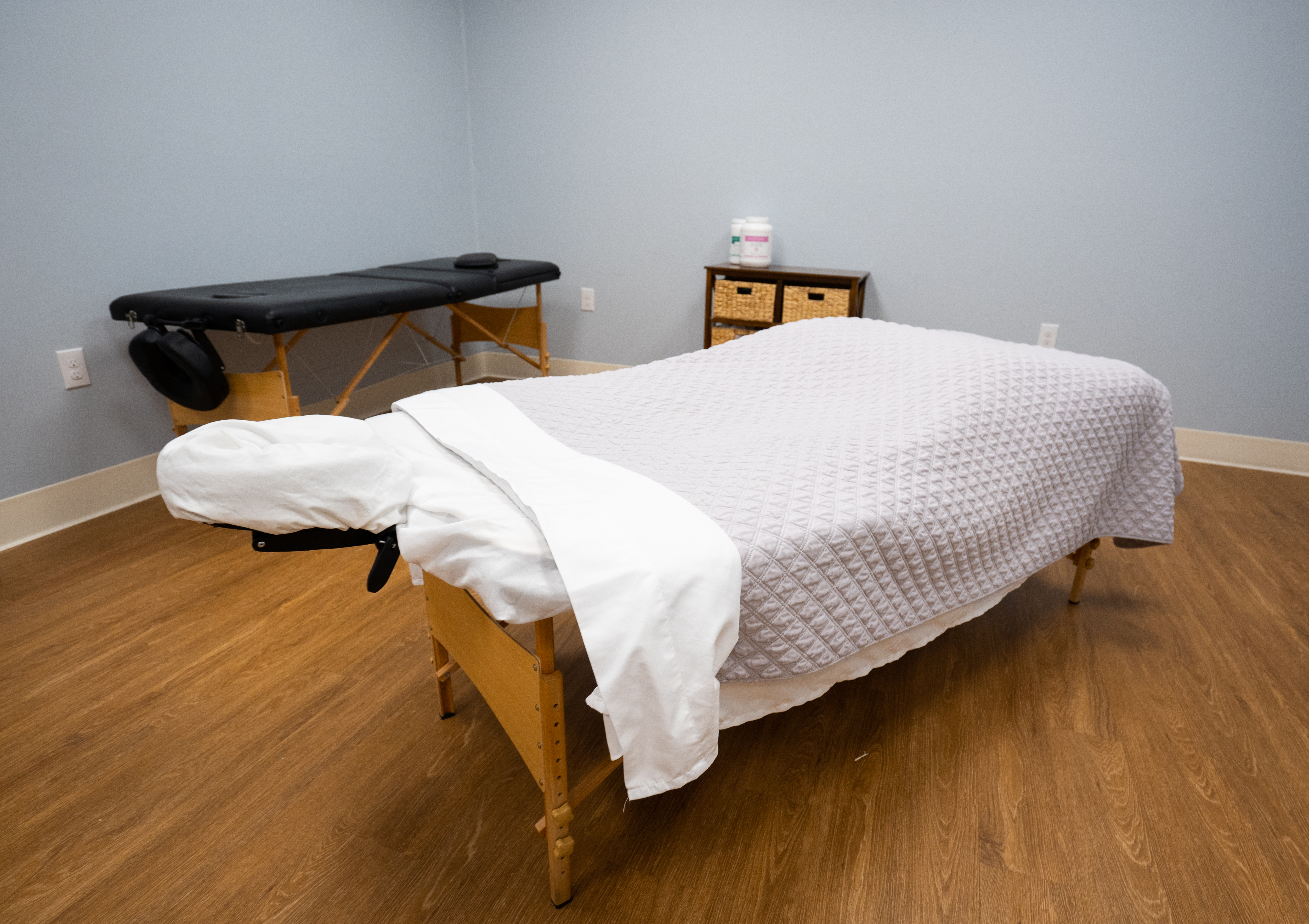 Peaceful massage room with two treatment tables