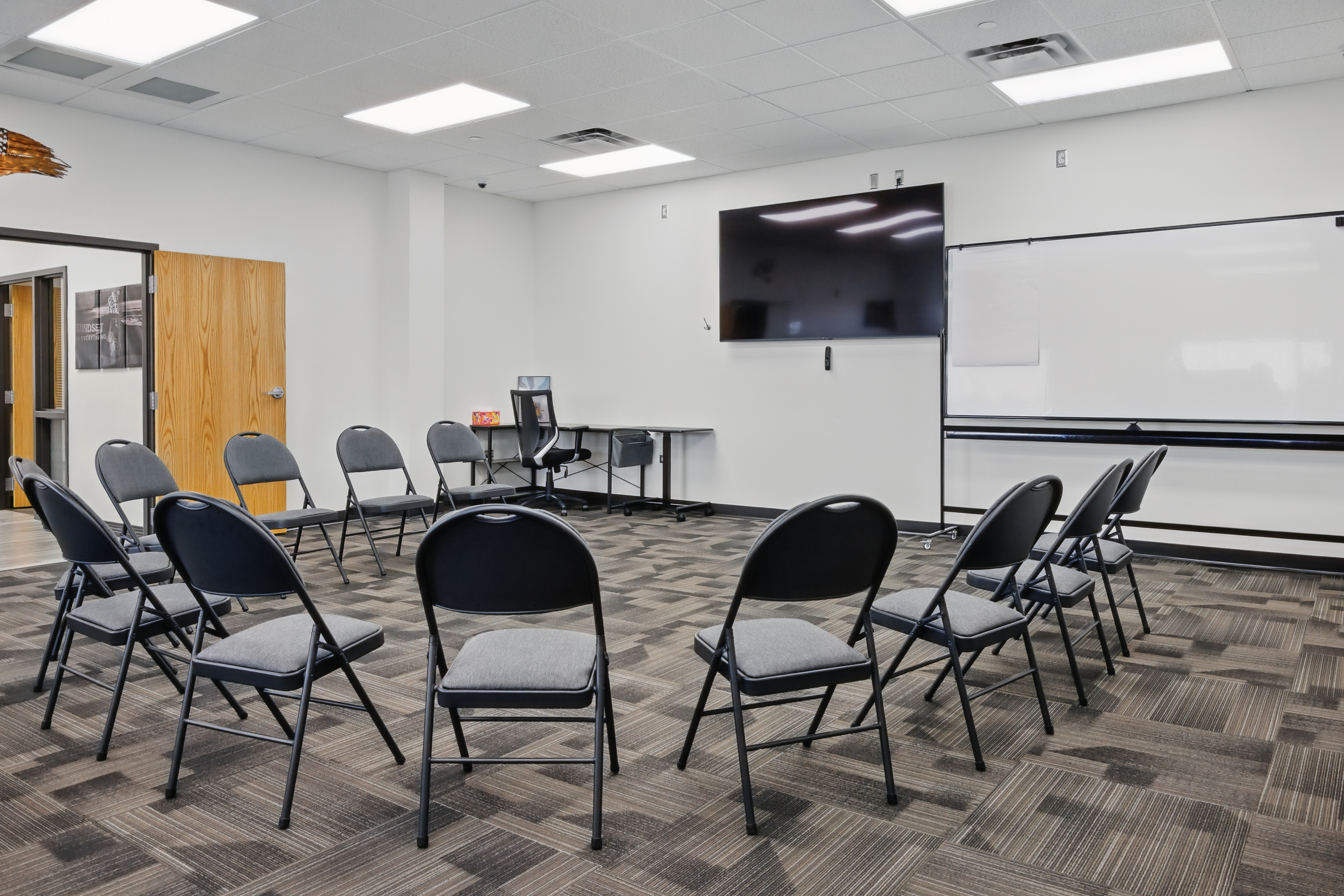 Large therapy room with chairs arranged in a circle
