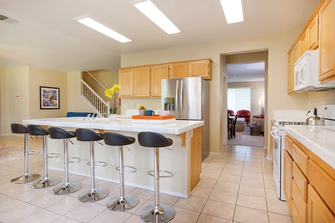 Spacious kitchen with island seating and stainless appliances