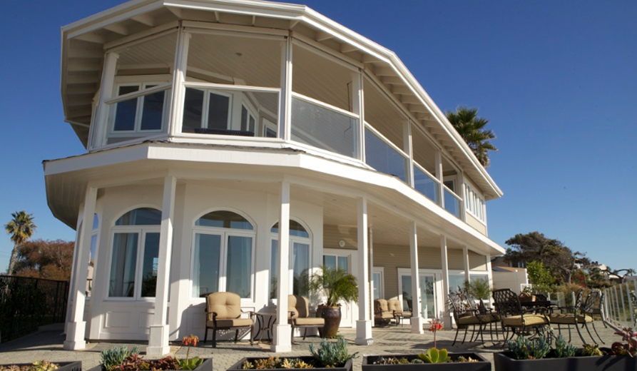 Large patio with outdoor seating and ocean views.