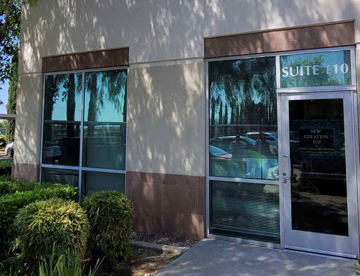 Exterior view of Suite 110 office with glass windows and door