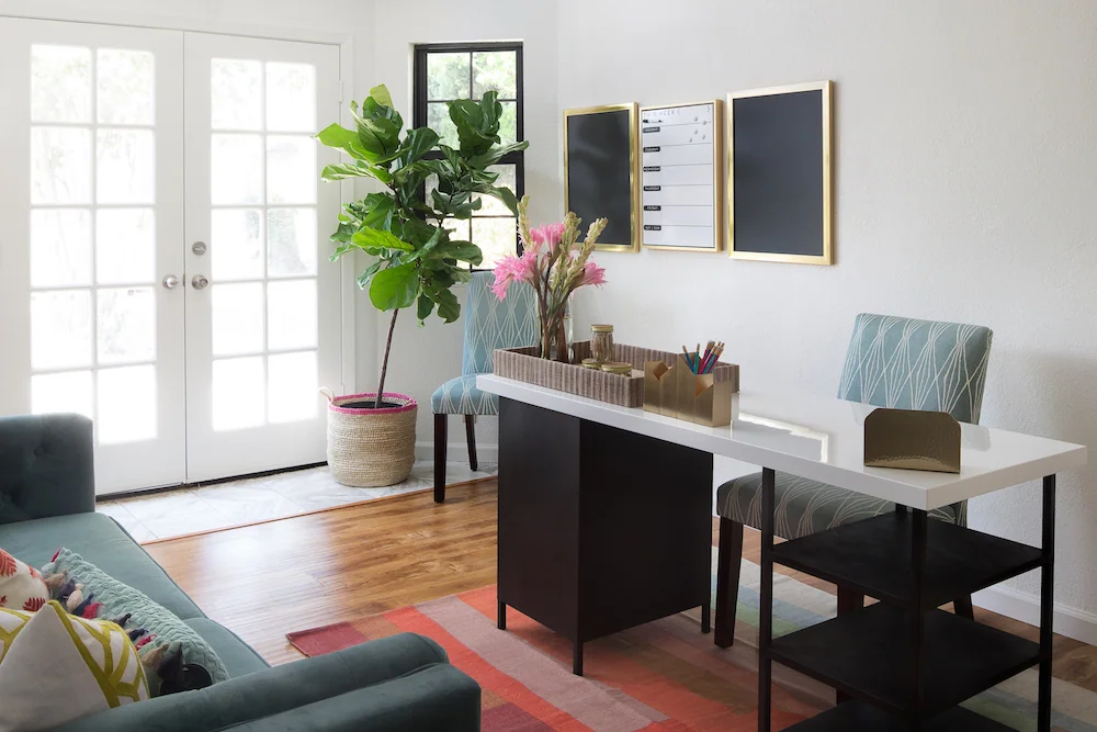 Home office with desk, chair, and natural light