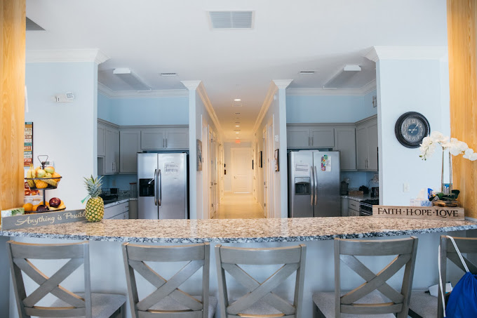 Granite island kitchen with twin refrigerators