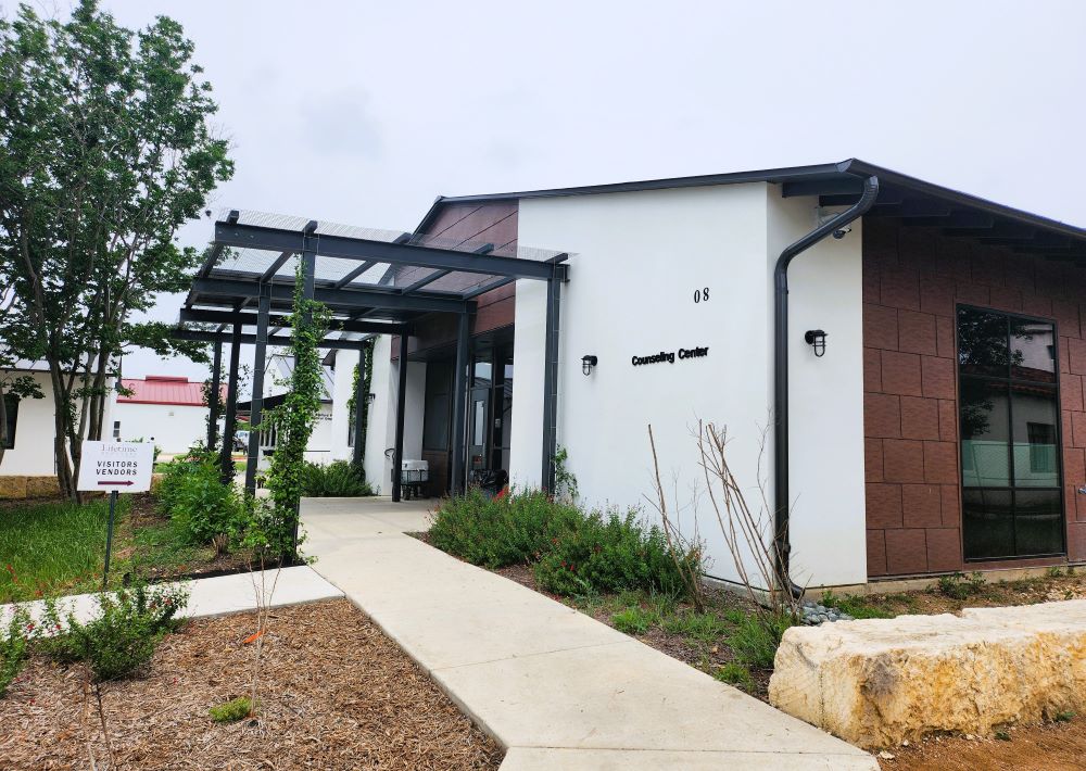 Modern counseling center entrance with sign