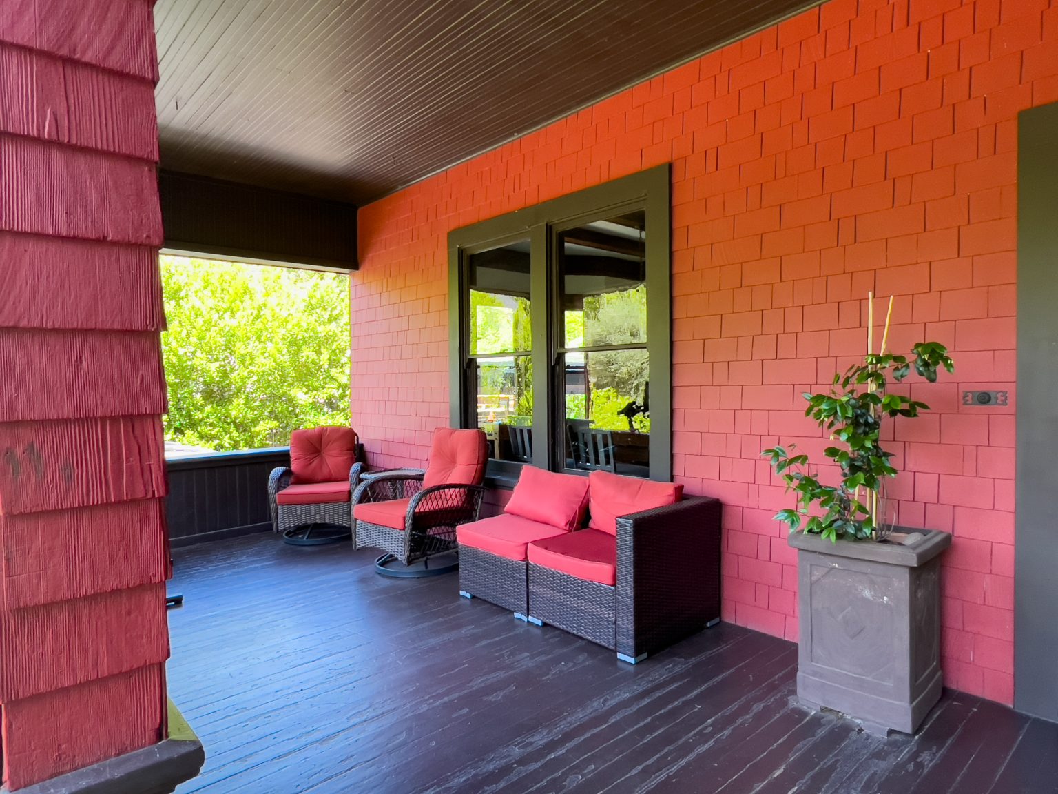 Covered porch with cushioned seating for relaxation