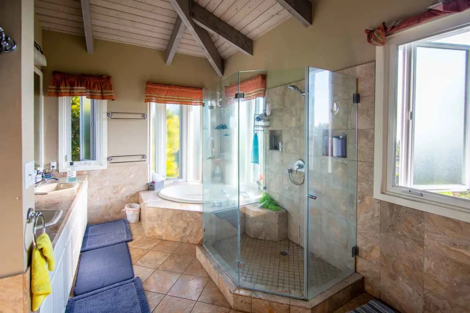 Spacious bath with glass shower and large tub