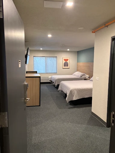 Spacious bedroom with twin beds and modern decor